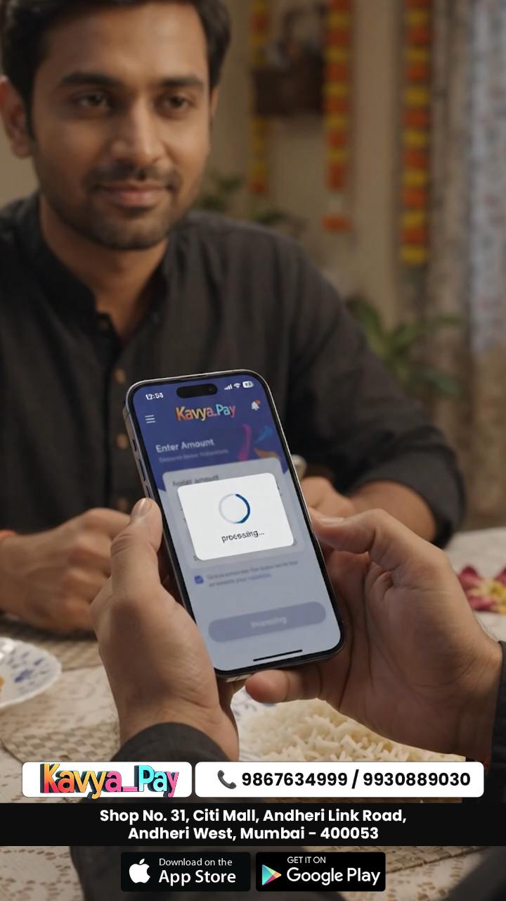 Hands holding a phone showing the Kavya Pay payment screen mid-transaction, in a warm home interior.