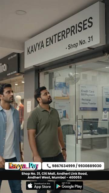 The Kavya Enterprises shopfront in a Mumbai mall, two men walking in past the payments signage.